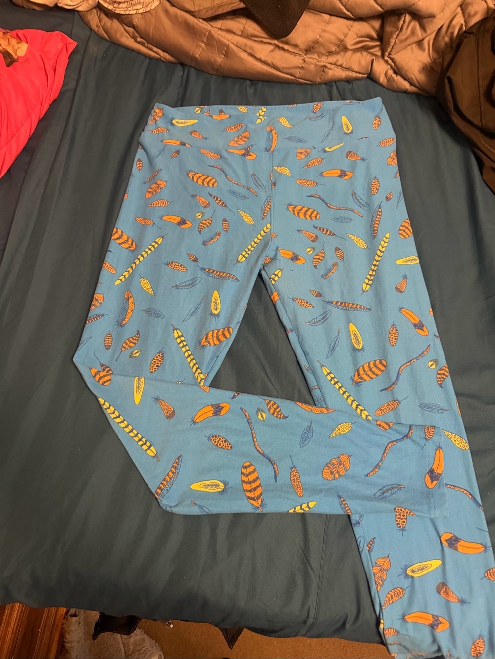LuLaRoe Blue Leggings with Orange and Yellow Feather Print